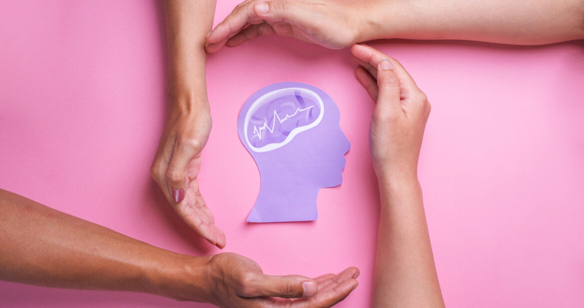 hands-protecting-a-brain-concept-on-pink-2026-03-17-08-14-50-utc
