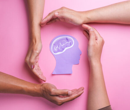 hands-protecting-a-brain-concept-on-pink-2026-03-17-08-14-50-utc