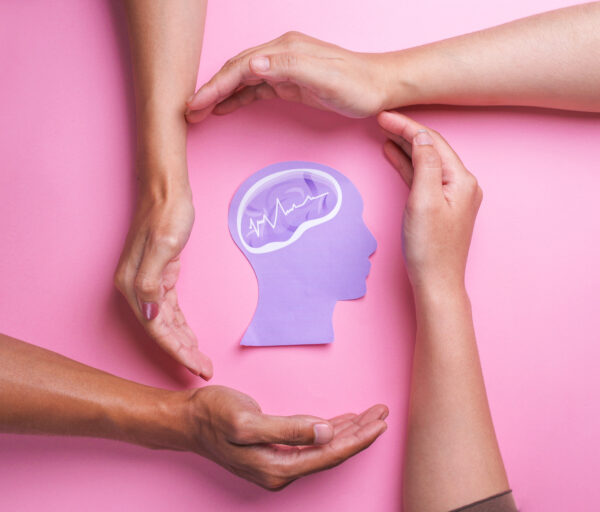 hands-protecting-a-brain-concept-on-pink-2026-03-17-08-14-50-utc